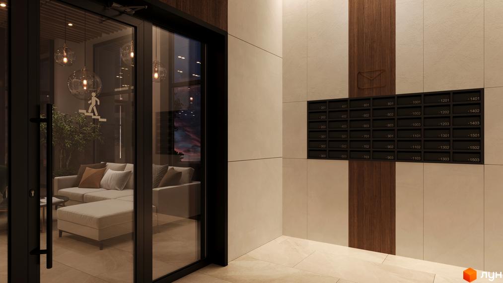 Вхідна група житлового комплексу SYMBOL з диванами та деревами всередині, та поштовими скриньками зовні.