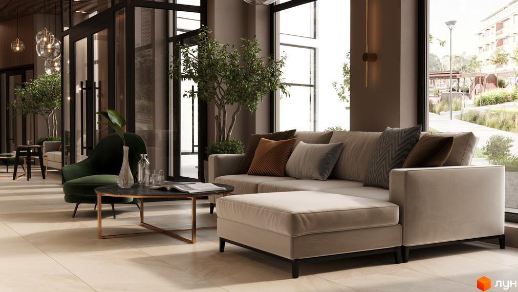 Вітальня зона ЖК SYMBOL з диваном та кріслом біля великих вікон, що виходять на зелену зону з доріжками та будівлями.