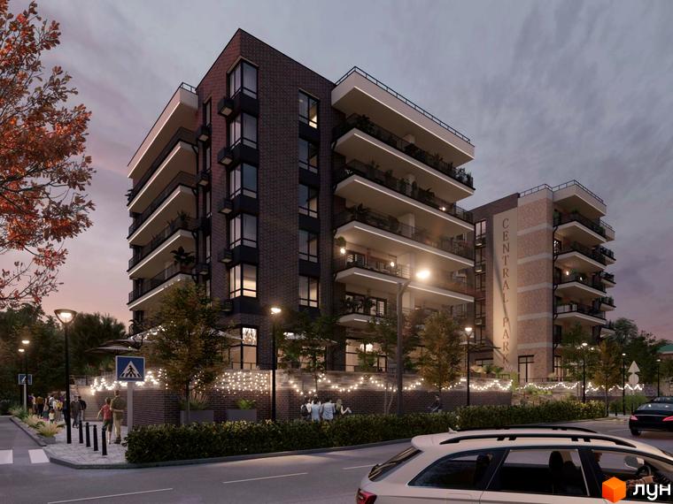 Зовнішній вигляд житлового комплексу CENTRAL PARK з цегляним фасадом та балконами. Прибудинкова територія з деревами та освітленням.