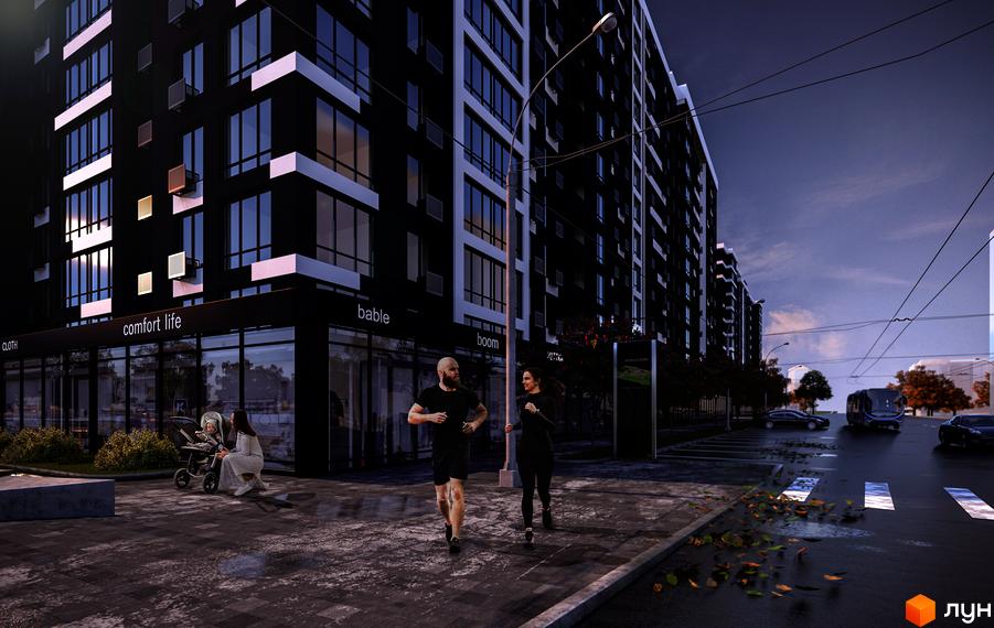 Новобудова Comfort Park з чорним фасадом та білими елементами. Поруч протікає вулиця з трамваєм та пішохідна зона з людьми.