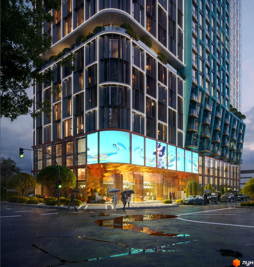 Сучасний житловий комплекс на вулиці Володимиро-Либідська, 25, з яскравою підсвіткою фасаду та великими екранами. Навколо будинку доглянута територія з деревами та доріжками.