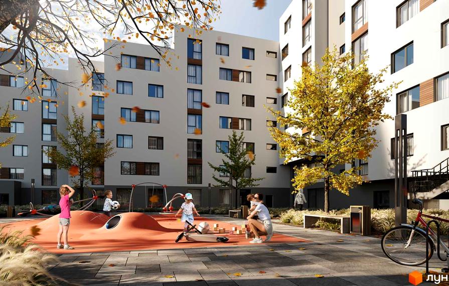 Житловий комплекс Повітряна HALL з дитячим майданчиком та деревами восени. Сучасна архітектура будинків та облаштована прибудинкова територія.