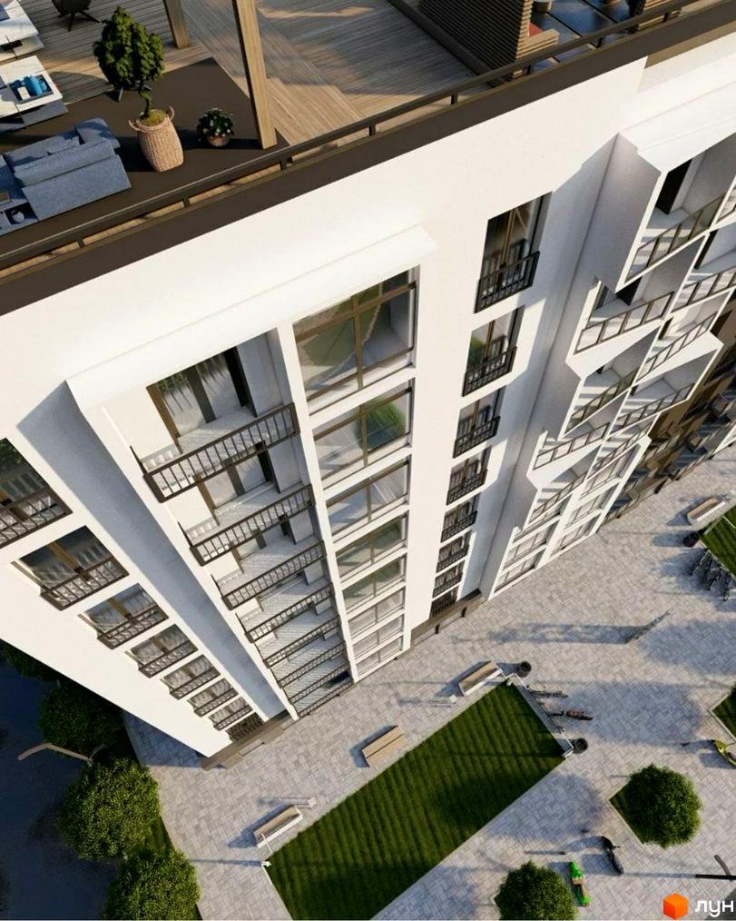 Вигляд зверху на Житловий комплекс Сонячна Долина: білий багатоповерховий будинок з балконами та внутрішній двір з газонами, лавками та деревами.