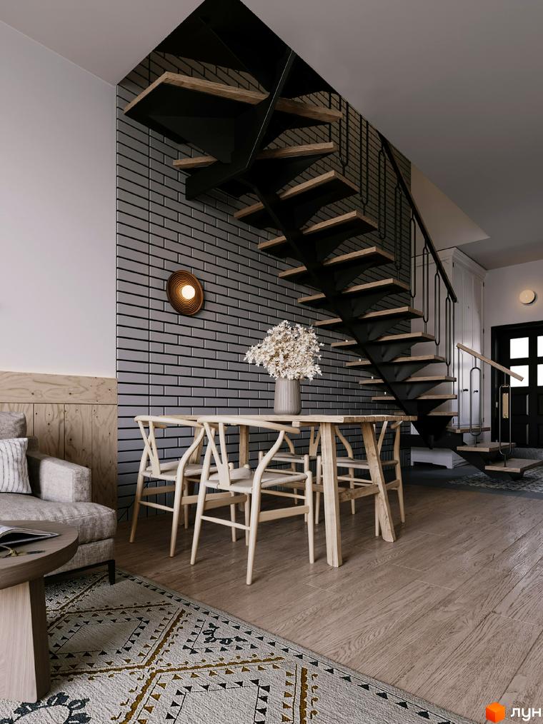 Інтер'єр вітальні з обідньою зоною біля сходів у світлих тонах. Стильні дерев'яні меблі та декоративне освітлення створюють затишну атмосферу.