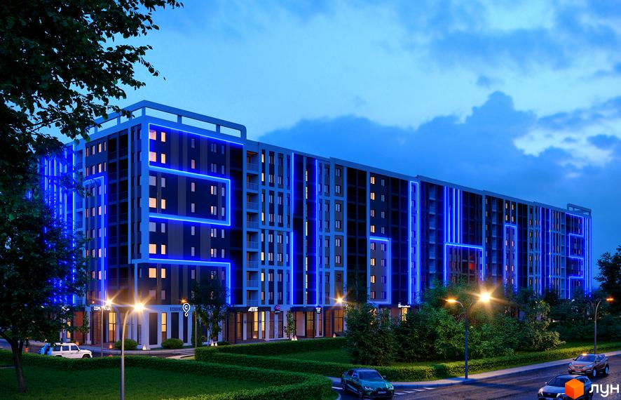 Житловий комплекс КЕЛЬЦЕ з яскравою синьою підсвіткою фасадів, вікнами з теплим світлом та зеленою прибудинковою територією.