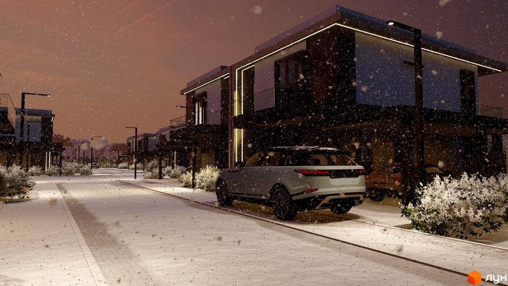 Зимовий вид на будинки в Котеджному містечку Stone Village. На передньому плані білий автомобіль та засніжена дорога.