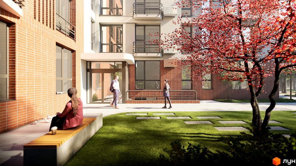 Зовнішній вигляд житлового комплексу РЕМ з цегляним фасадом та прибудинковою територією з деревом та газоном. Фото новобудови.