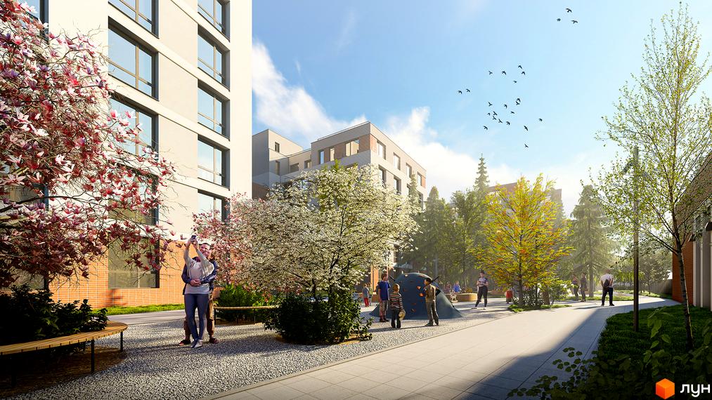 Житловий комплекс РЕМ з фасадами світлих кольорів та прибудинковою територією з деревами, квітами та дитячим майданчиком.