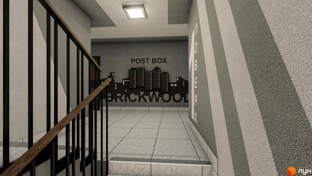 Вхідна група в житловому комплексі Brickwood 2 з поштовими скриньками та сходами. Дизайн під'їзду з сірими стінами та плиткою на підлозі.