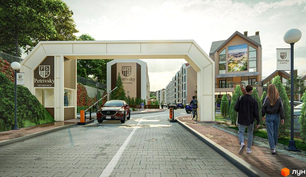В'їзд на територію житлового комплексу Petrivsky Residence з охороною та шлагбаумом. На території розташовані будинки та зелені насадження.