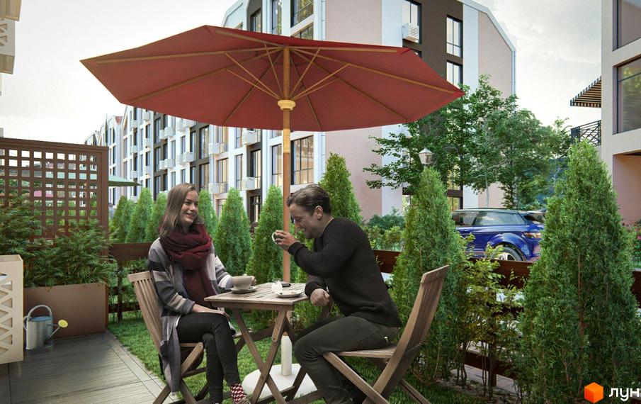 Житловий комплекс Petrivsky Residence: пара на терасі під парасолькою на тлі багатоповерхових будинків та зелених насаджень.