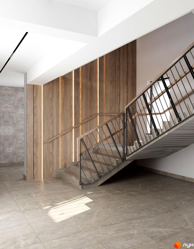 Інтер'єр сходової клітки у Будівельному проєкті Янтарний. Сходи з металевими поручнями та дерев'яними панелями на стінах.