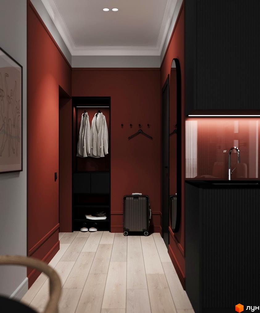Апарт-готель PRAUD select: стильний передпокій з червоними стінами, чорною шафою, вішаками для одягу, валізою та дзеркалом. Підлога світла дерев'яна.