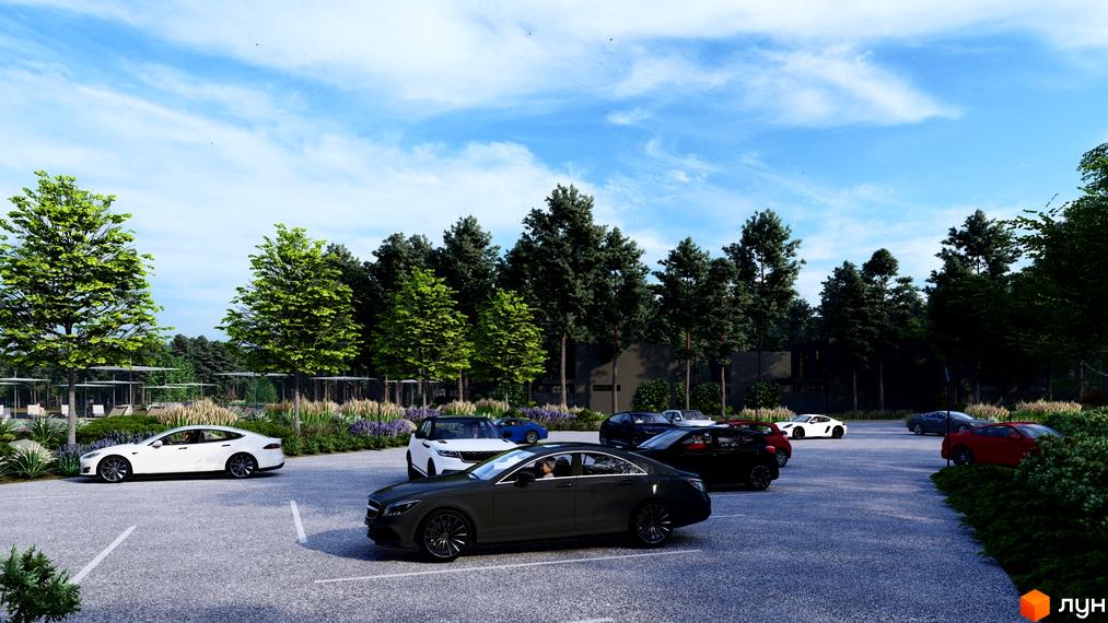 Котеджне містечко Goodwill Residence з парковкою та зеленими деревами. Паркінг з автомобілями на фоні будівель та природи.