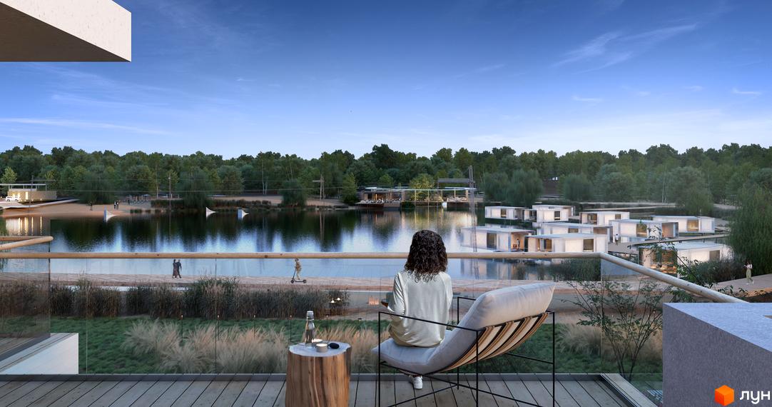 Сучасний житловий комплекс Vlasne Misto з білими будинками на березі озера. На території комплексу є пляж, зона відпочинку та зелені насадження.