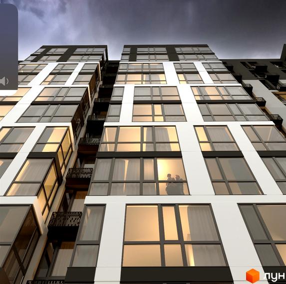 Фасад житлового комплексу Статус з великими вікнами та балконами, що відбивають захід сонця. Сучасна архітектура новобудови.