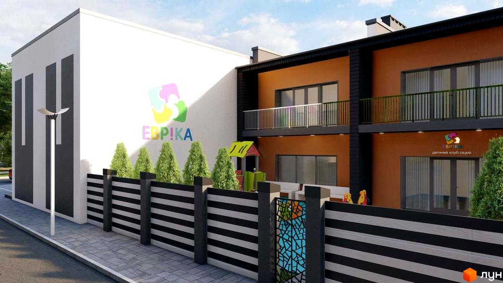 Фасад таунхаусів „Dream Town“ з білими та помаранчевими стінами, балконами та дитячим майданчиком. Видно огорожу, тротуар та вуличний ліхтар.