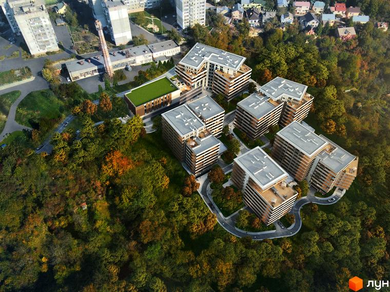 Комплекс MARVEL Hill з багатоповерховими будинками та зеленою прибудинковою територією восени.