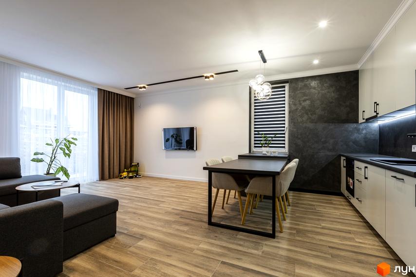 Інтер'єр квартири в житловому комплексі Струмочок 2 з кухнею, їдальнею та зоною відпочинку.