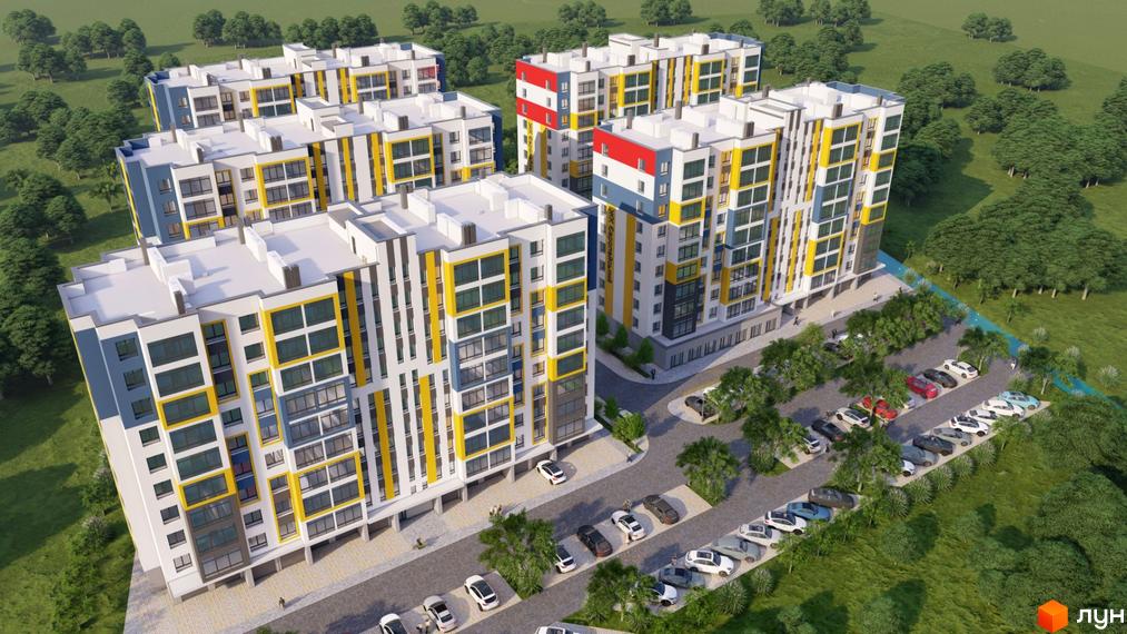 Житловий комплекс Європейський квартал з яскравим фасадом та парковкою біля будівель. Огляд новобудови з дрона.