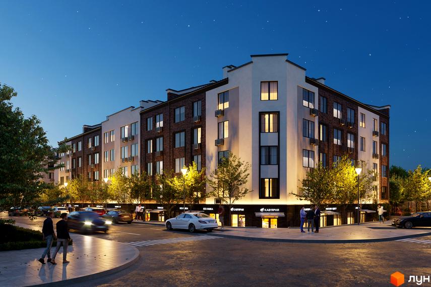 Житловий комплекс МІЛАНЖ має цегляний та білий фасади, багато вікон та кондиціонерів. Територія перед будинком освітлена ліхтарями та деревами, поруч дорога з автомобілями та пішохідною зоною.