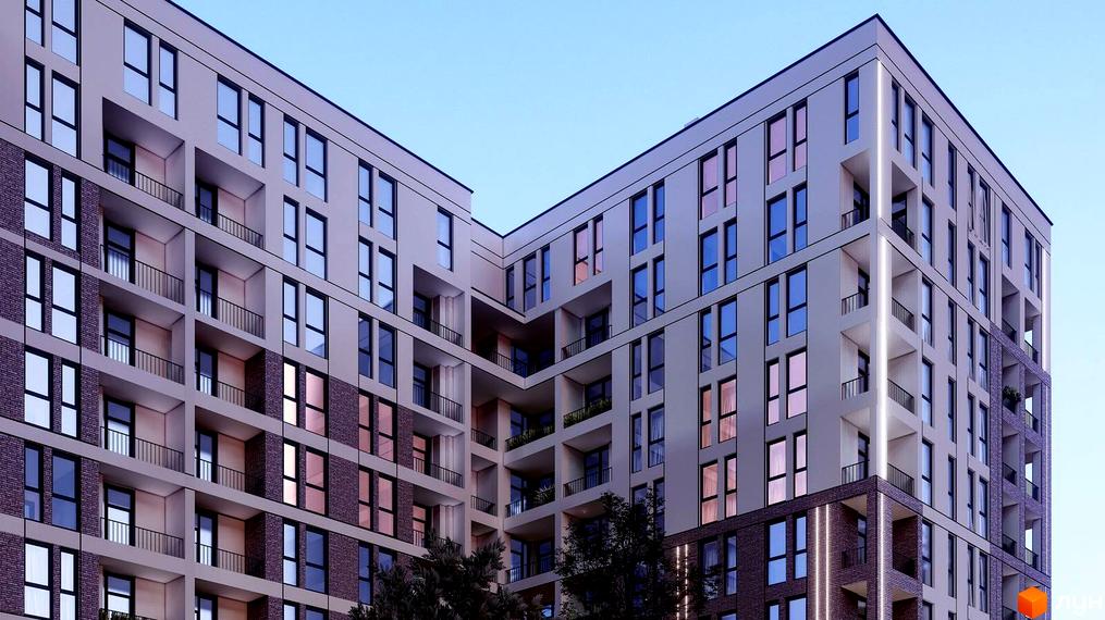 Зовнішній вигляд новобудови ЖК Зоряний з численними балконами та великими вікнами. Будівельний проєкт має багатоповерхові секції та цегляне оздоблення нижніх поверхів.