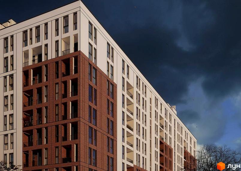 Зовнішній вигляд новобудови ЖК Зоряний з цегляним фасадом та білими елементами. Будинок має багато вікон та балконів.