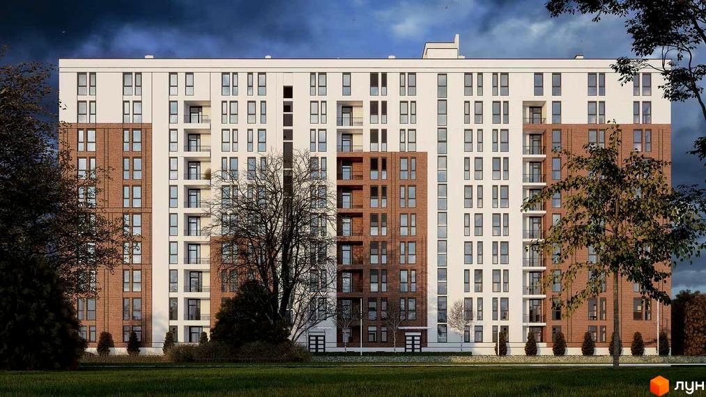 Зовнішній вигляд новобудови ЖК Зоряний з цегляними та білими фасадами, численними вікнами та балконами, на тлі темного неба. Навколо будівлі зелена галявина та дерева.