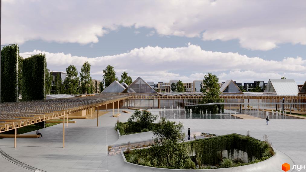 Зовнішній вигляд житлового комплексу Vlasne Misto з пірамідальними дахами та просторою прибудинковою територією з фонтанами та зеленню. Сучасний житловий комплекс для комфортного життя.