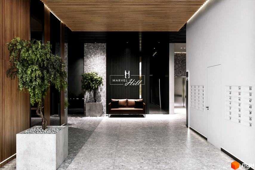 Лобі житлового комплексу MARVEL Hill з диваном, рослинами та поштовими скриньками. Сучасний дизайн інтер'єру новобудови.