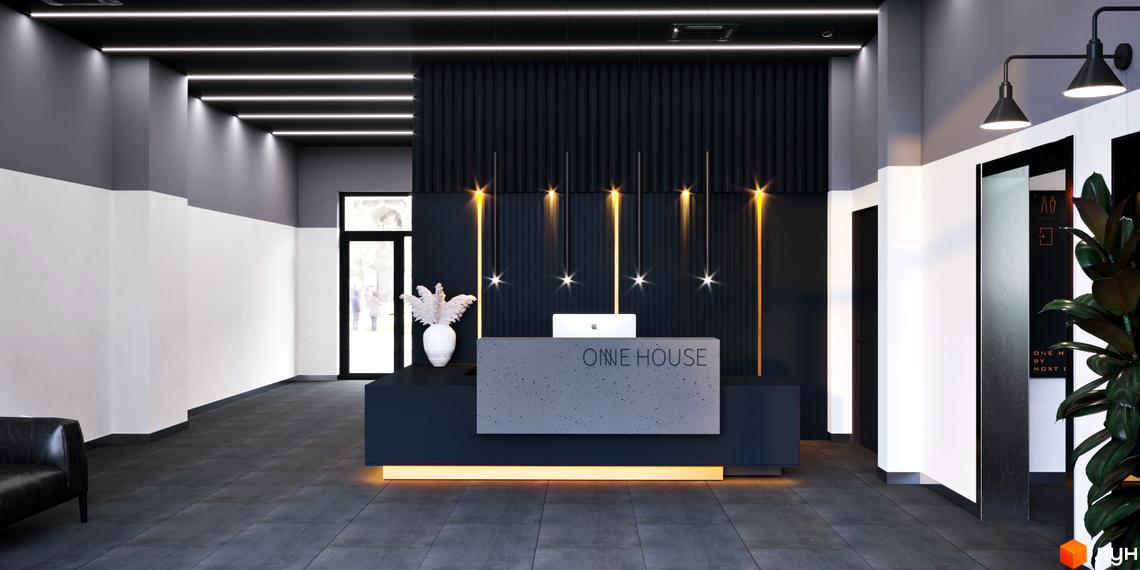 Приміщення рецепції Житлового комплексу One House з чорно-білим оздобленням, лінійним освітленням стелі та декоративними світильниками.