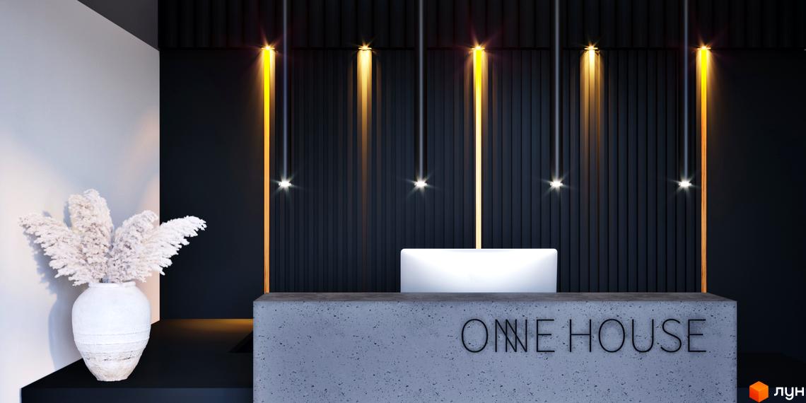 Рецепція Житлового комплексу One House: бетонна стійка, темна стіна з вертикальними світловими лініями та декоративна ваза з білими рослинами.