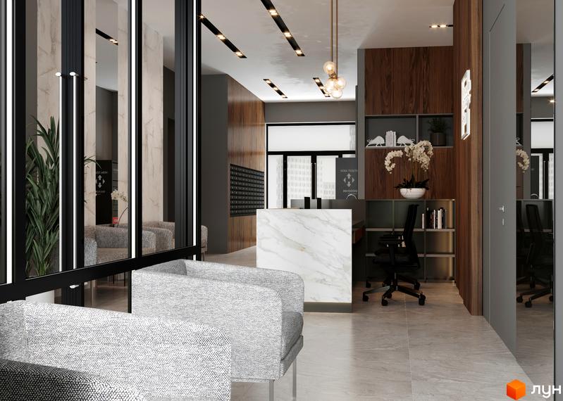 Інтер'єр холу з місцями для очікування в Будівельному проєкті A+Я. Вигляд на стійку рецепції та зони відпочинку з м'якими кріслами.