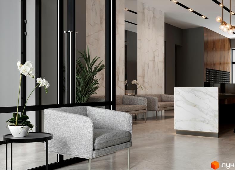 Інтер'єр зони очікування в Житловому районі A+Я: м'які крісла, стійка ресепшн з мармуровим оздобленням, живі рослини.