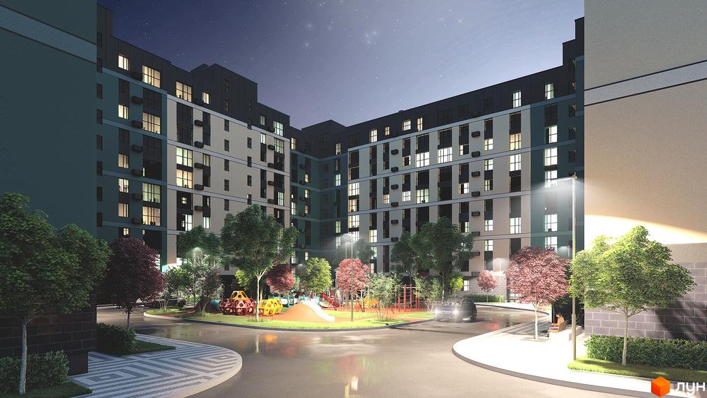 Житловий комплекс Green Street з фасадами у блакитних та бежевих тонах, освітлений ліхтарями вночі. На прибудинковій території розташований дитячий майданчик та зелені насадження.