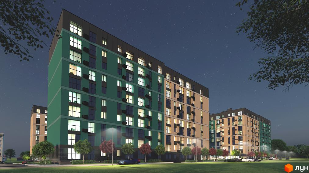 Житловий комплекс Green Street з фасадами зеленого та пісочного кольору вночі. Навколо будівель розташована доглянута прибудинкова територія з деревами та освітленням.