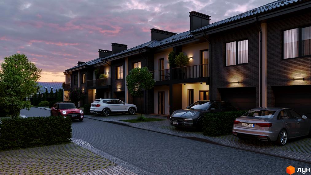 Таунхауси Family Town з цегляним фасадом та індивідуальними гаражами, прибудинкова територія з бруківкою та зеленими насадженнями.