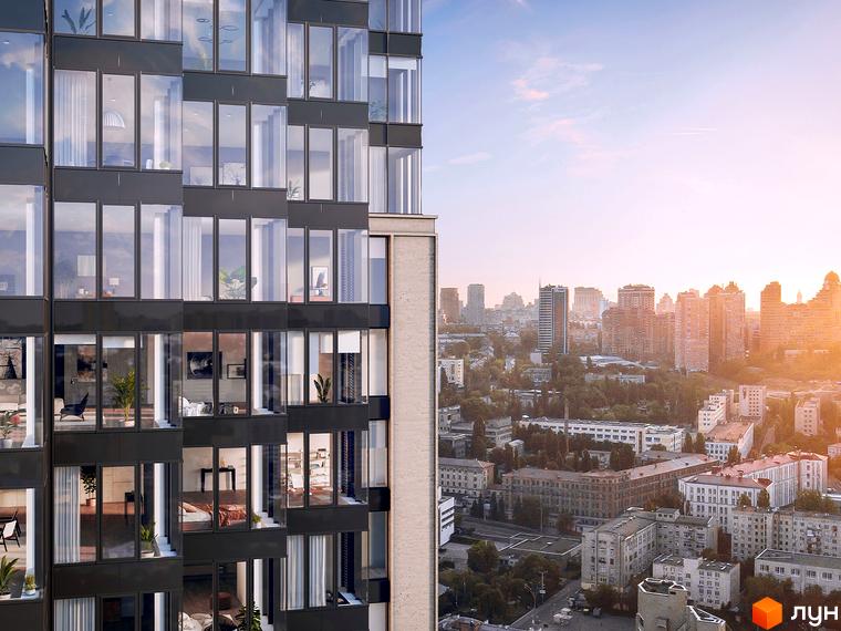 Висотна будівля житлового комплексу A136 Highlight Tower з великими вікнами та панорама міста на заході сонця.
