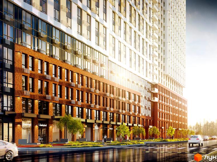 Новобудова Новий Автограф з цегляним фасадом та скляними балконами. Навколо будинку зелена зона з деревами та пішохідними доріжками.