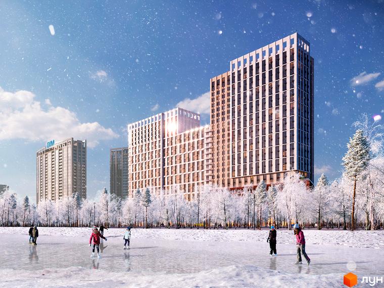 Житловий комплекс Новий Автограф взимку з людьми, що катаються на ковзанах на замерзлій водоймі та засніженими деревами на фоні.