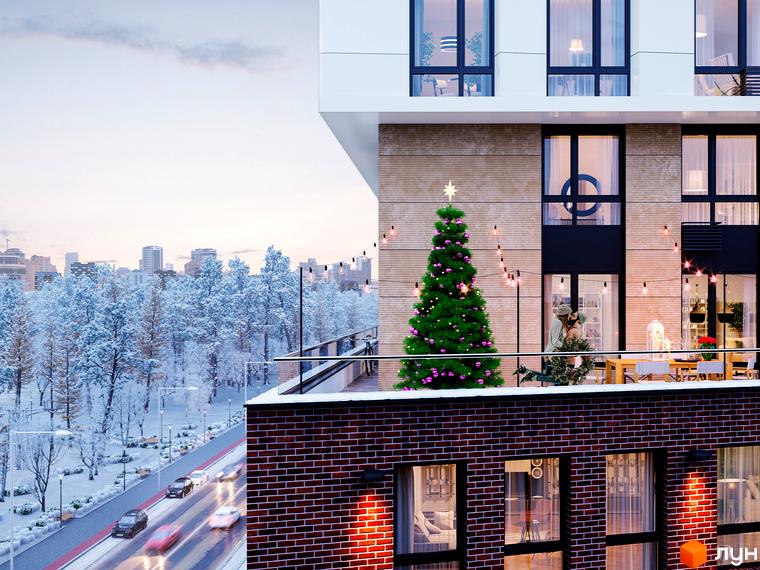 Новобудова ЖК Новий Автограф з ялинкою на балконі та зимовим містом на тлі. Зовнішній вигляд будинку та прибудинкова територія.