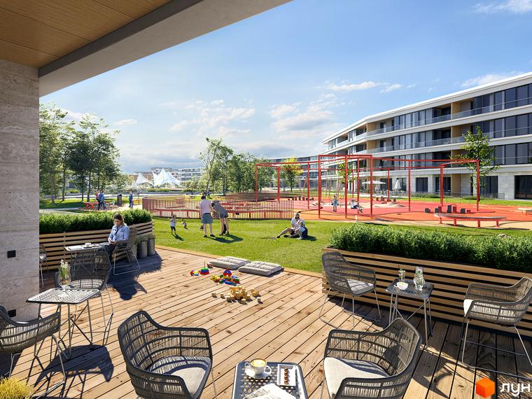 Новобудова Park Lake City з великими вікнами та балконами. Тераса з плетеними меблями та дитячий майданчик на зеленій території.