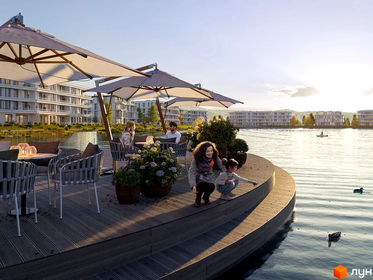 Житловий комплекс Park Lake City з видом на озеро. Набережна з терасою та відпочиваючими біля води.