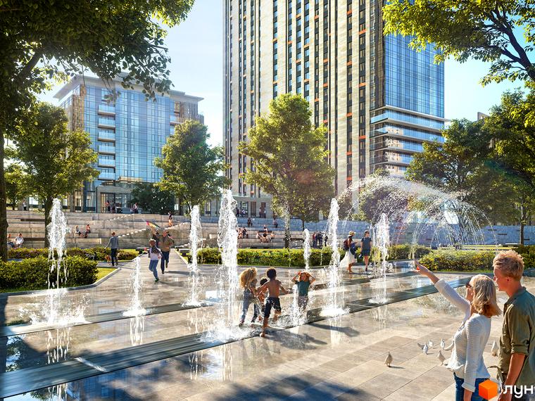 Житловий комплекс Метрополіс: високі будівлі з панорамними вікнами та зелена зона з фонтанами та відпочиваючими людьми.