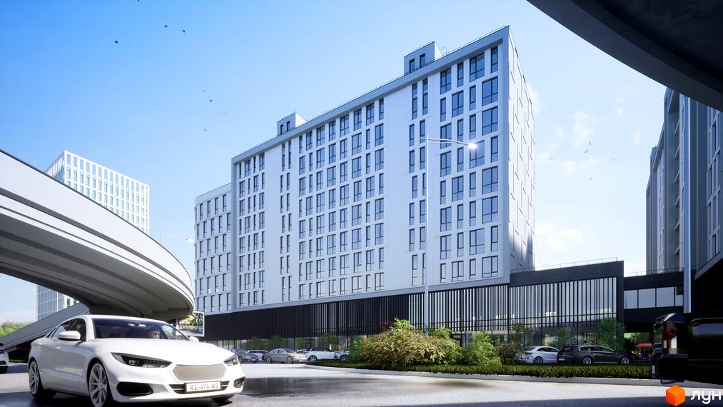 Зображення фасаду Житлового комплексу Kniahynyn-Center з великою кількістю вікон та припаркованими авто біля будинку.