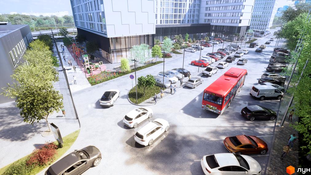 Зображення Житлового комплексу Kniahynyn-Center з виглядом на прибудинкову територію, де є парковка, тротуар та дитячий майданчик.