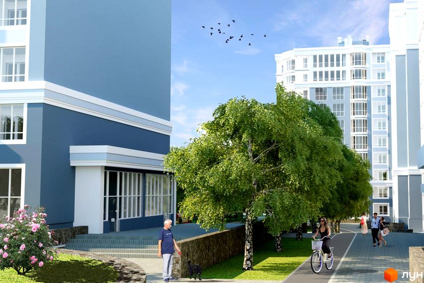 Житловий комплекс Лісовий з багатоповерховими будинками синьо-білого кольору та великими вікнами. Прибудинкова територія озеленена деревами, доріжками для прогулянок та відпочинку.