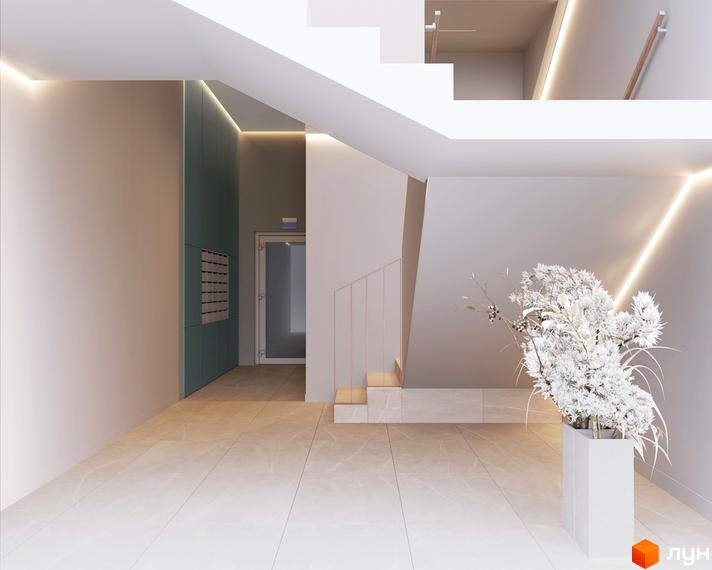 Сучасний дизайн входу в житловий комплекс Fenix з підсвічуванням та квітковою композицією.