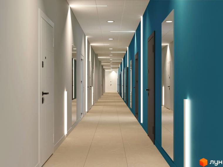 Сучасний коридор житлового комплексу Fenix з дверима та дзеркалами на стінах, що створює відчуття простору та світла.