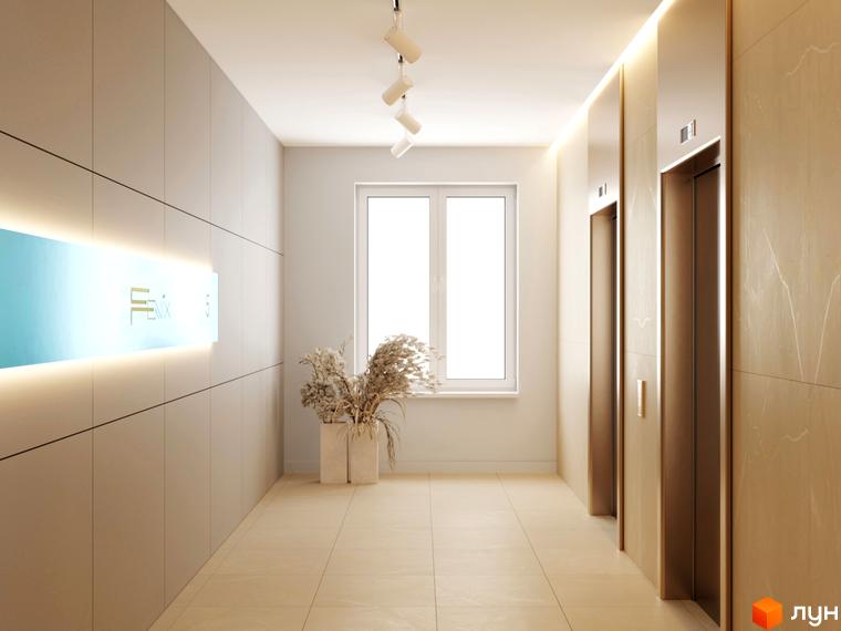 Сучасний дизайн холу житлового комплексу Fenix з підсвіченою вивіскою та елегантними ліфтовими дверима.